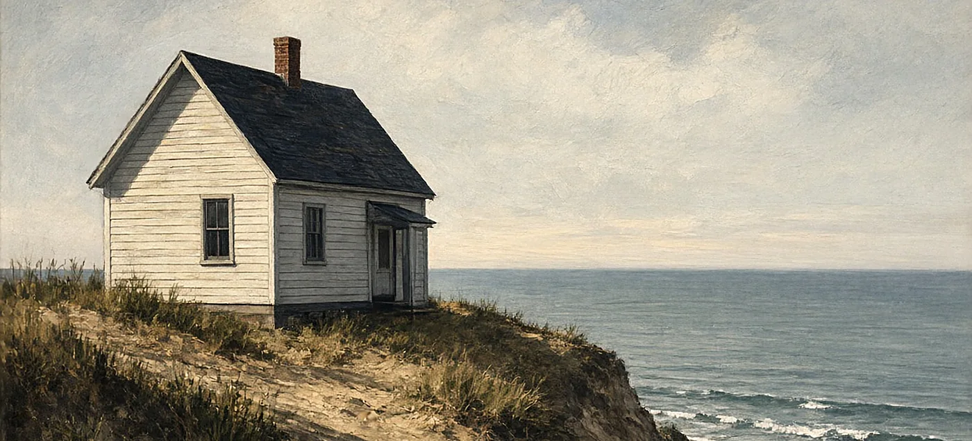 A painted cottage on a bluff above the sea